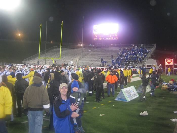 John DiBlasio holds son Johnny at the 2009 state championship game (photo courtesy of the DiBlasio family)